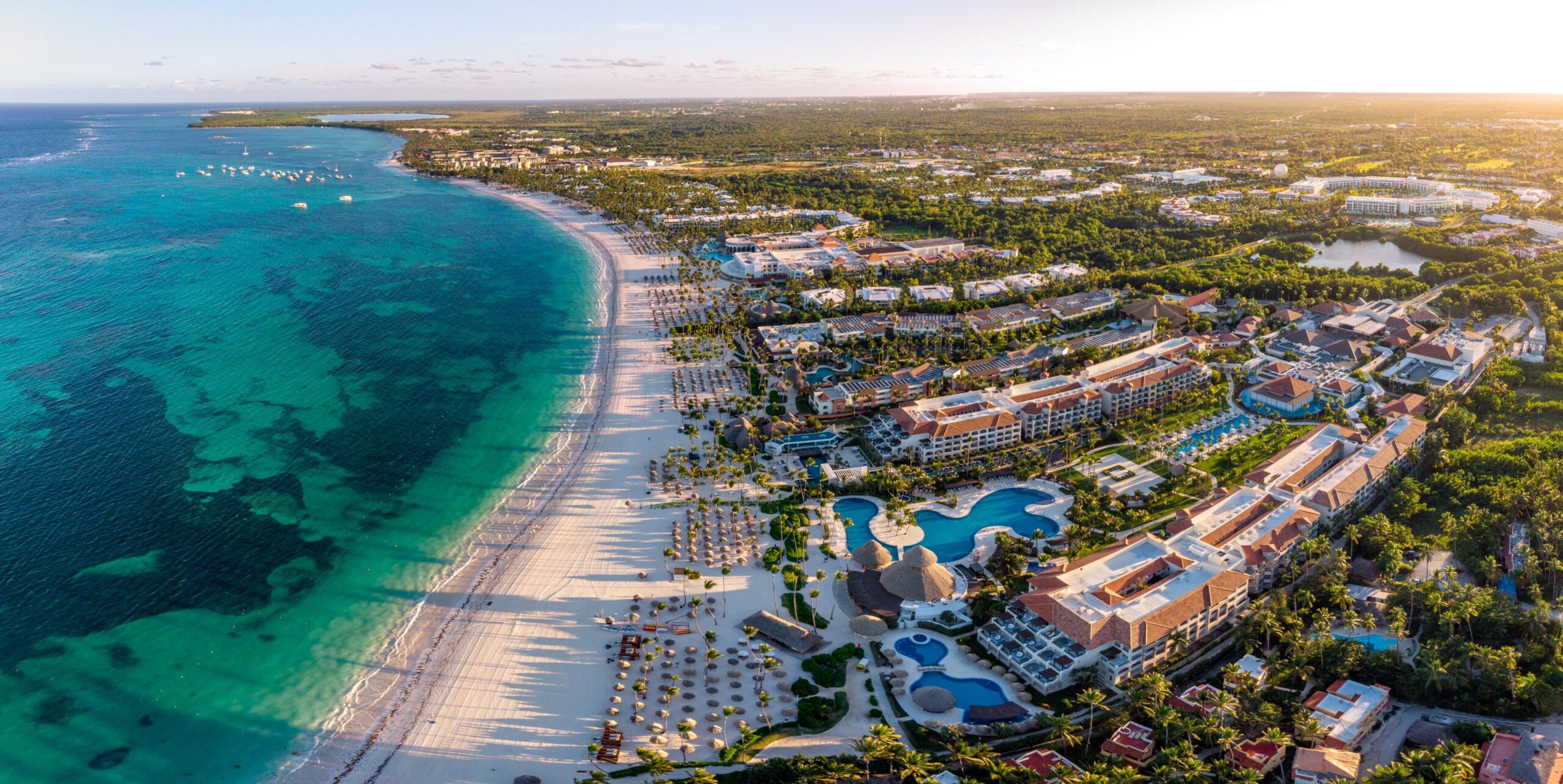 Aerial drone panorama view of beach resort hotels in Punta Cana, specifically known as Bávaro
