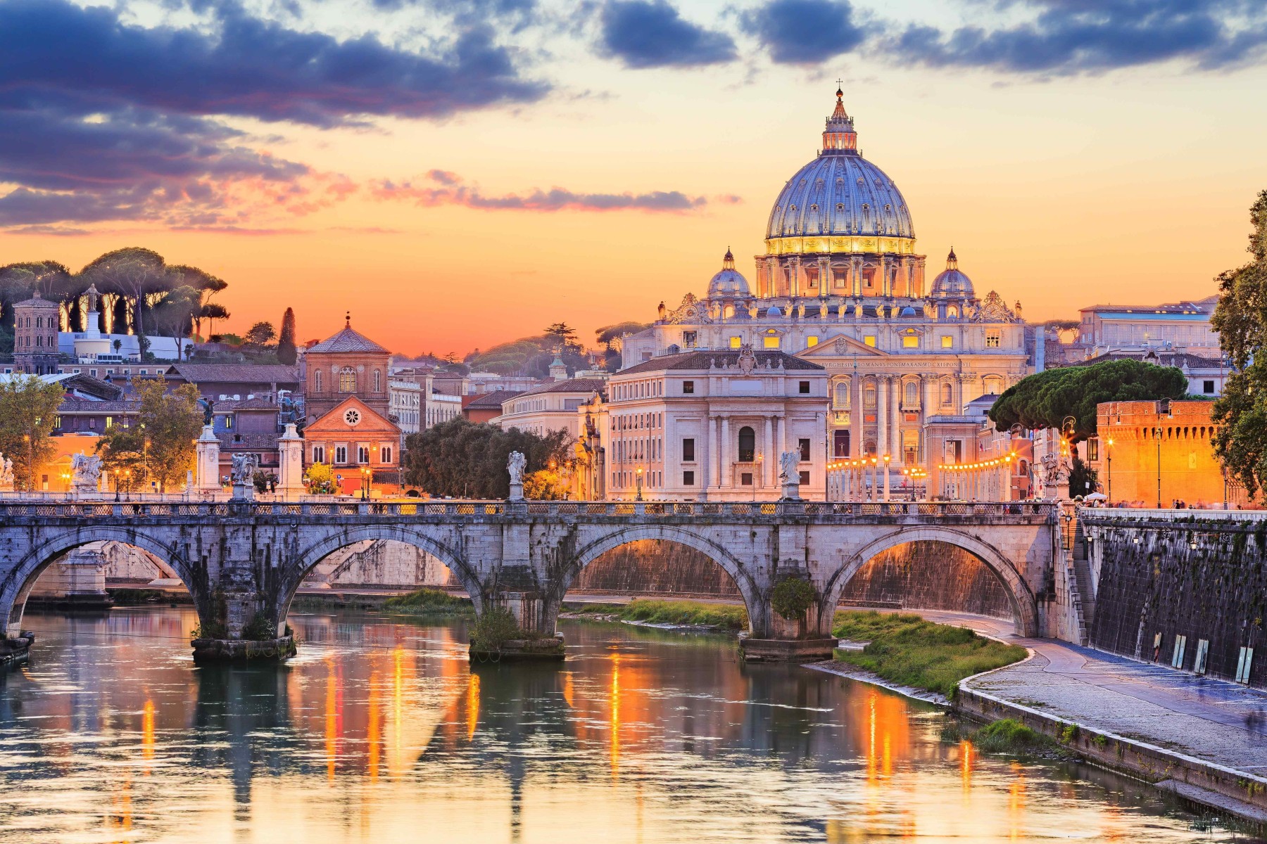 Ponte St. Angelo bridge and St. Peter's Basilica in Vatican City in Rome, Italy.