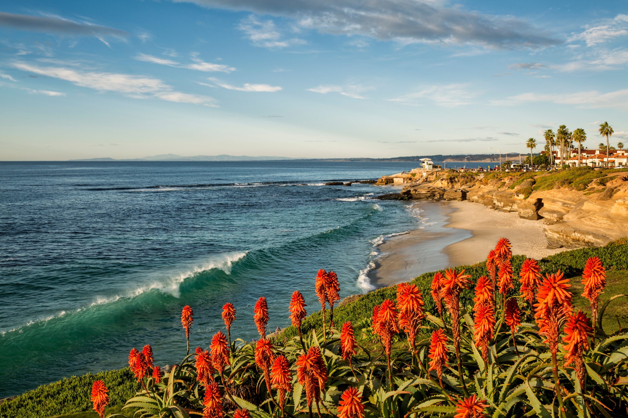 Clear waters and luxury coastal living make La Jolla Cove in San Diego a top-tier beach destination for July travelers